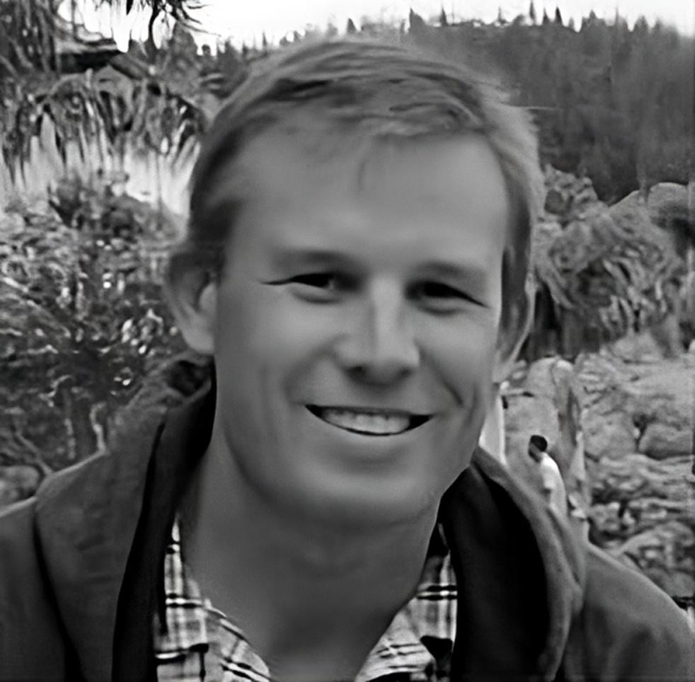 Man smiling back and white photo at ESGCX PR event